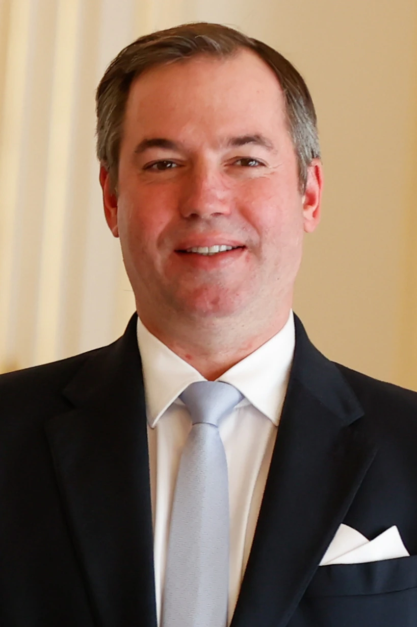 Portrait of Grand Duke Guillaume V of Luxembourg in a dark suit and tie