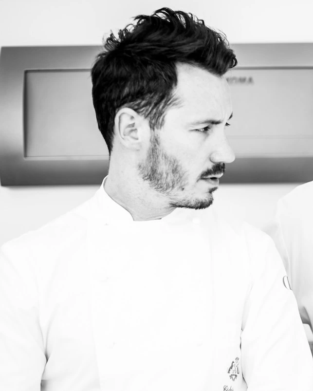 Portrait photo of French pastry chef Cédric Grolet in a white chef’s jacket