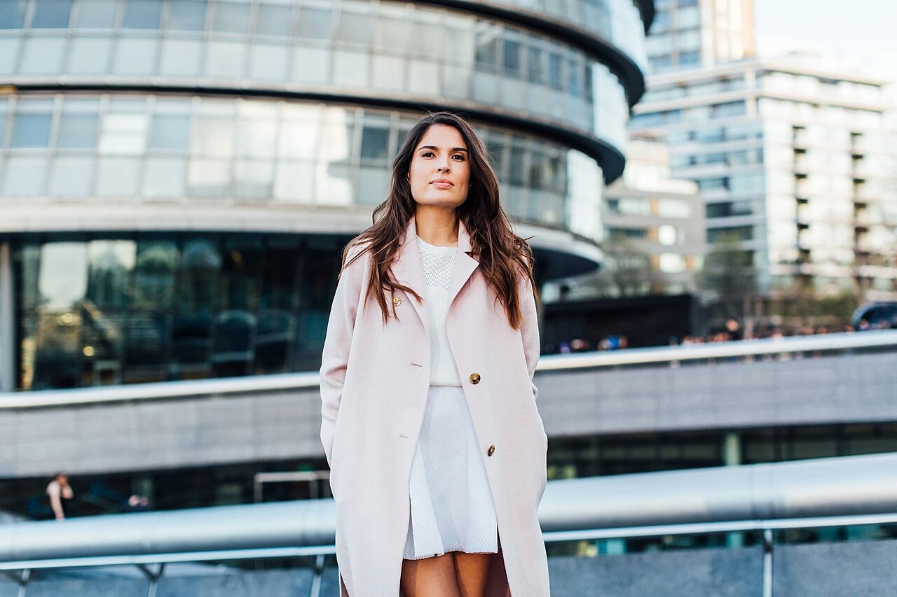 Marine Tanguy standing outdoors in front of modern buildings