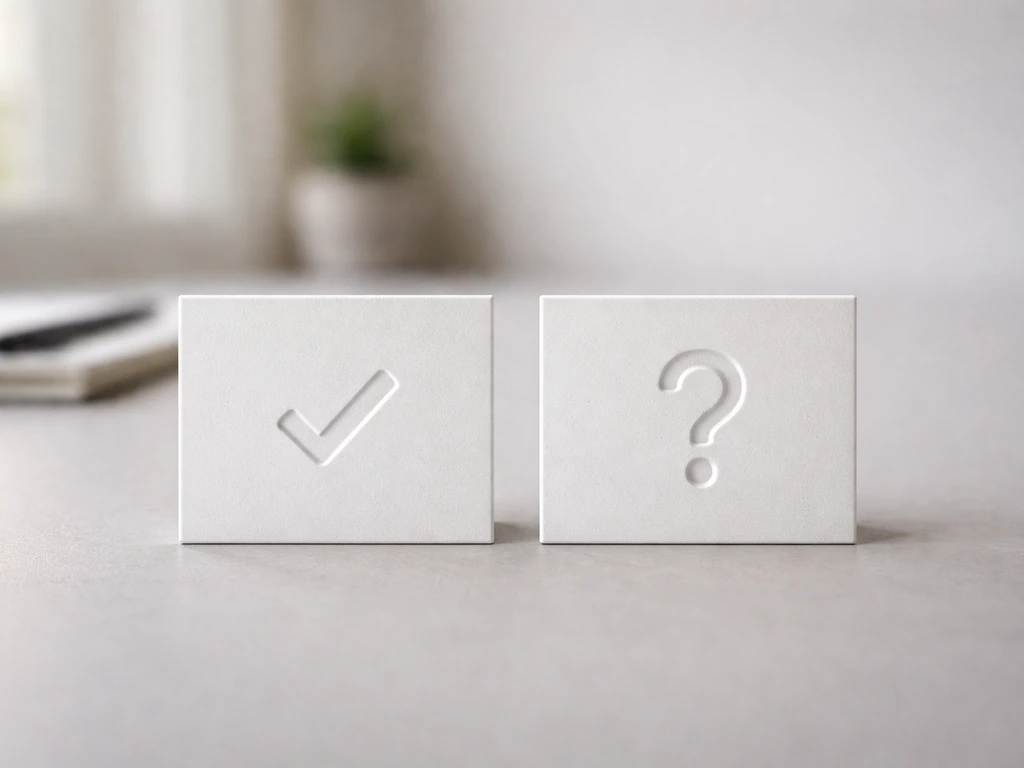 Minimal desk scene with separate verification and speculation cues using check and question symbols